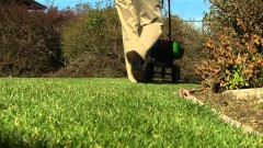 Man using lawn spreader